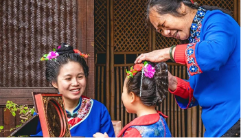 Traditional Meizhou women preparing ceremonial clothing.